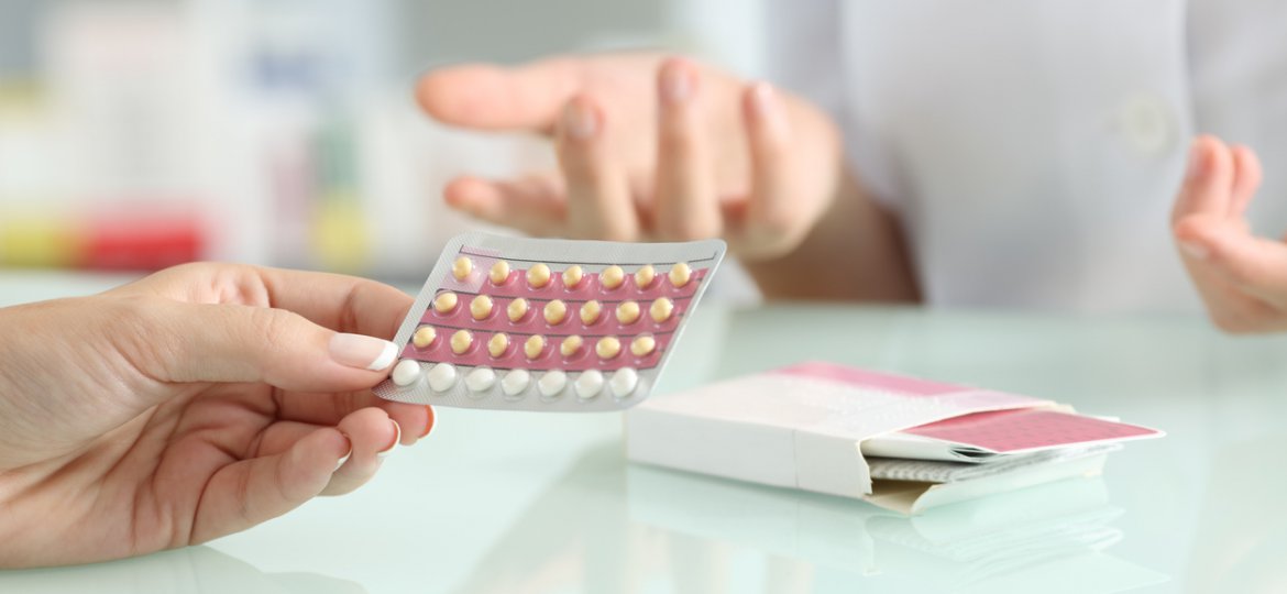 Girl buying contraceptive pills in a pharmacy