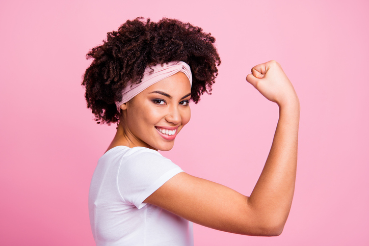 Close-up profile side view portrait of her she nice-looking attractive charming cute lovely powerful cheerful cheery wavy-haired girl showing muscles isolated over pink pastel background