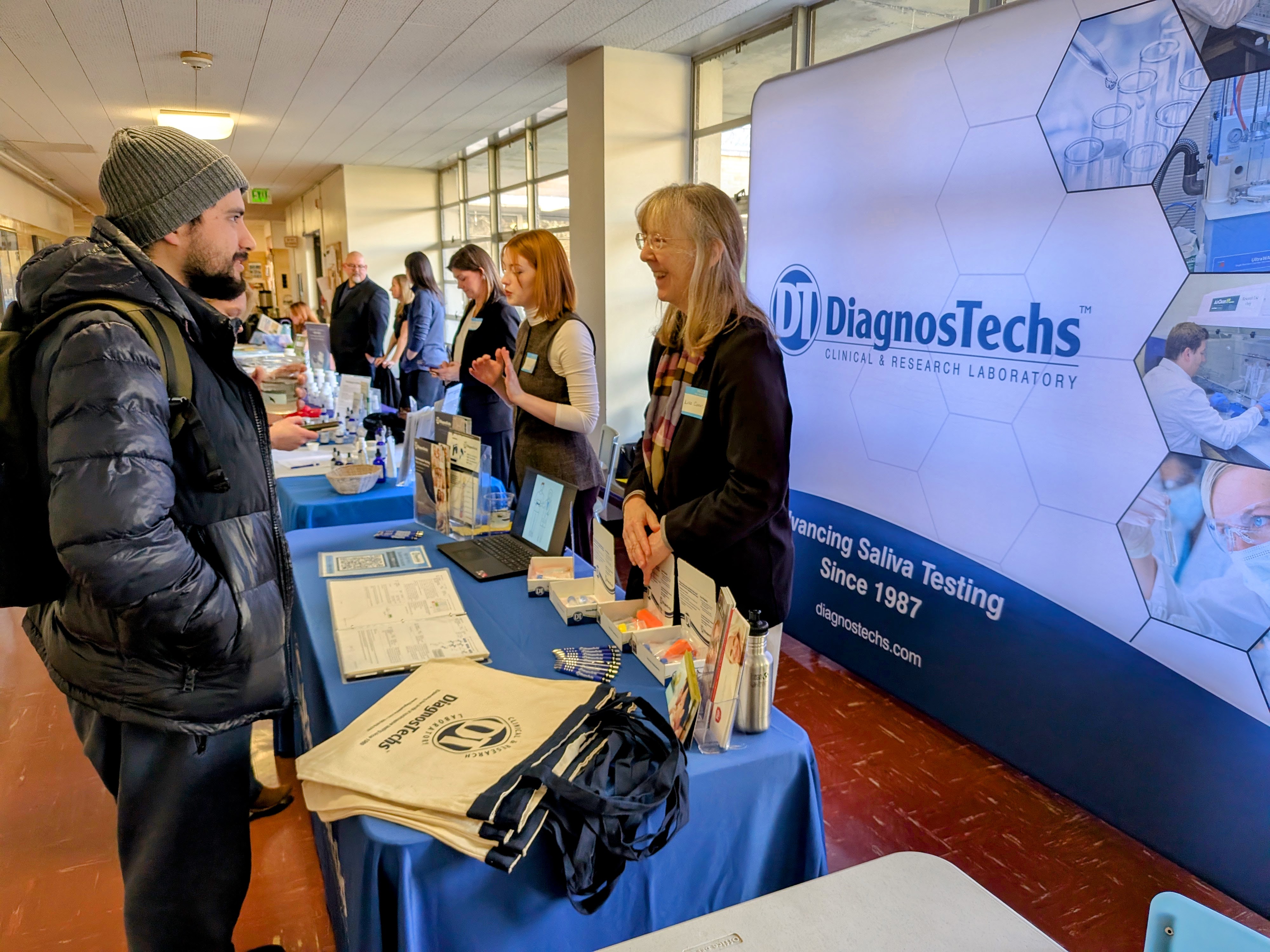 Student and Dr. Lisa Canar, ND Smiling while Conversing at Bastyr University
