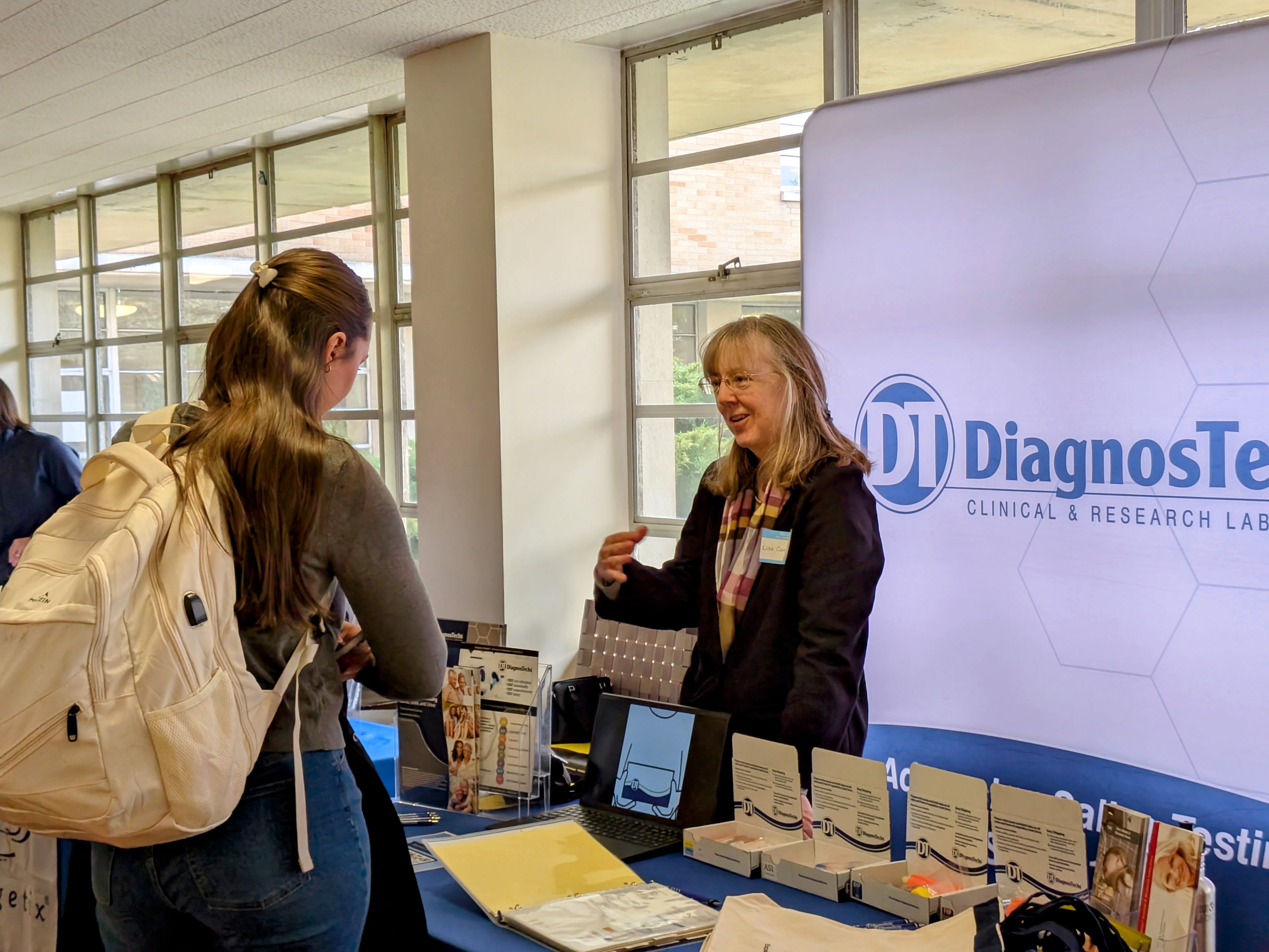 Dr. Lisa Canar, ND Smiling while Discussing DiagnosTechs Advanced Laboratory Testing at Bastyr University